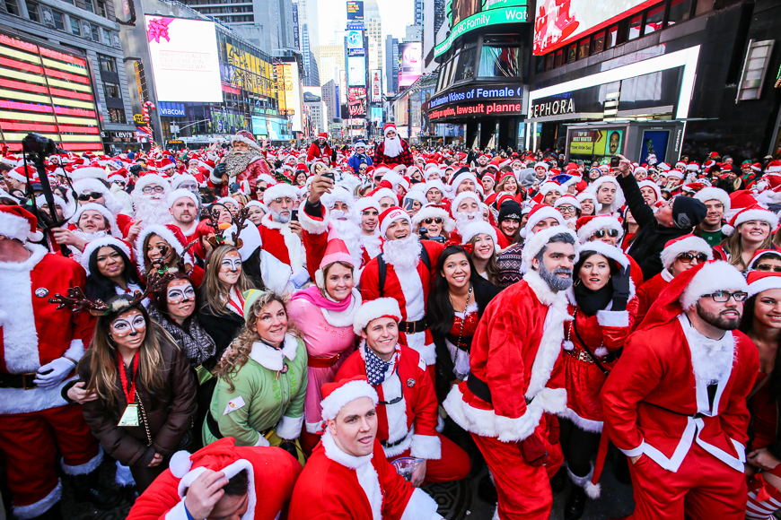 hundreds of costumed revelers filled times square to muster for the 17th annual santacon pub crawl