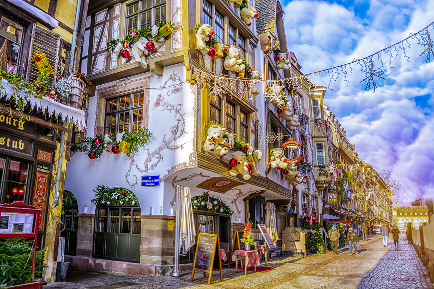 Streets and facades of houses, traditionally decorated with toys teddy bears for christmas