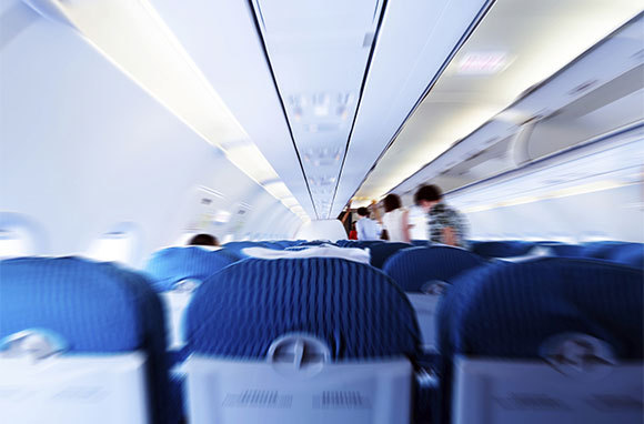 Sit in an Aisle Seat Within Five Rows of an Exit