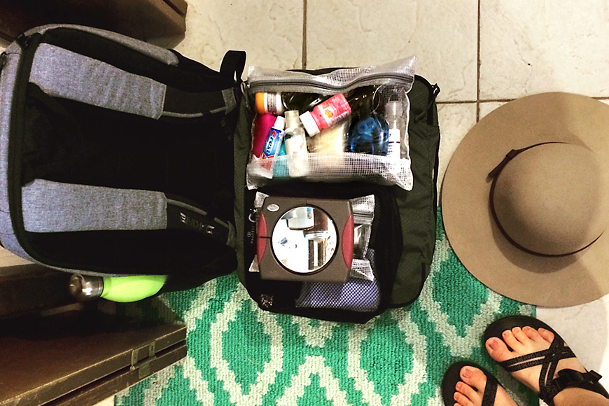 open suitcase showing a toiletry bag