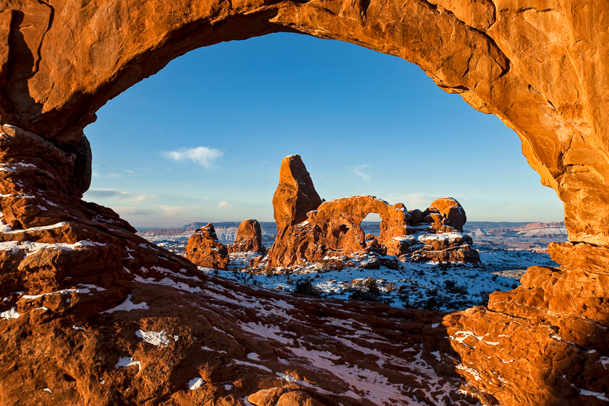 First light on turret arch framed by north window