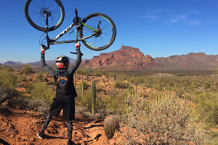 Man holds a bike in the air phoenix arizona