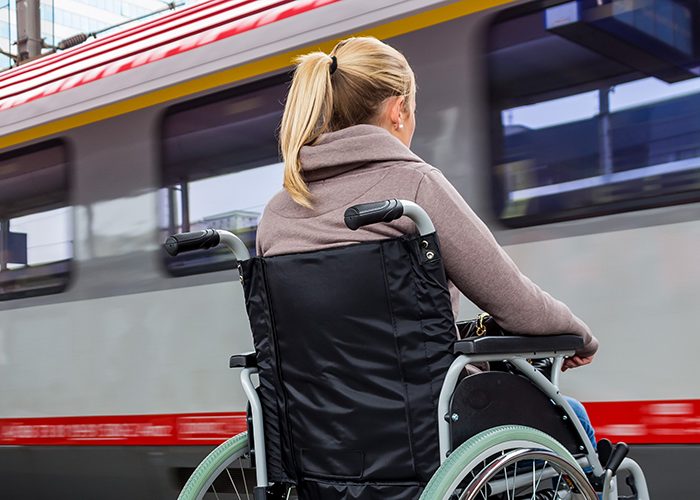 woman in wheelchair with train