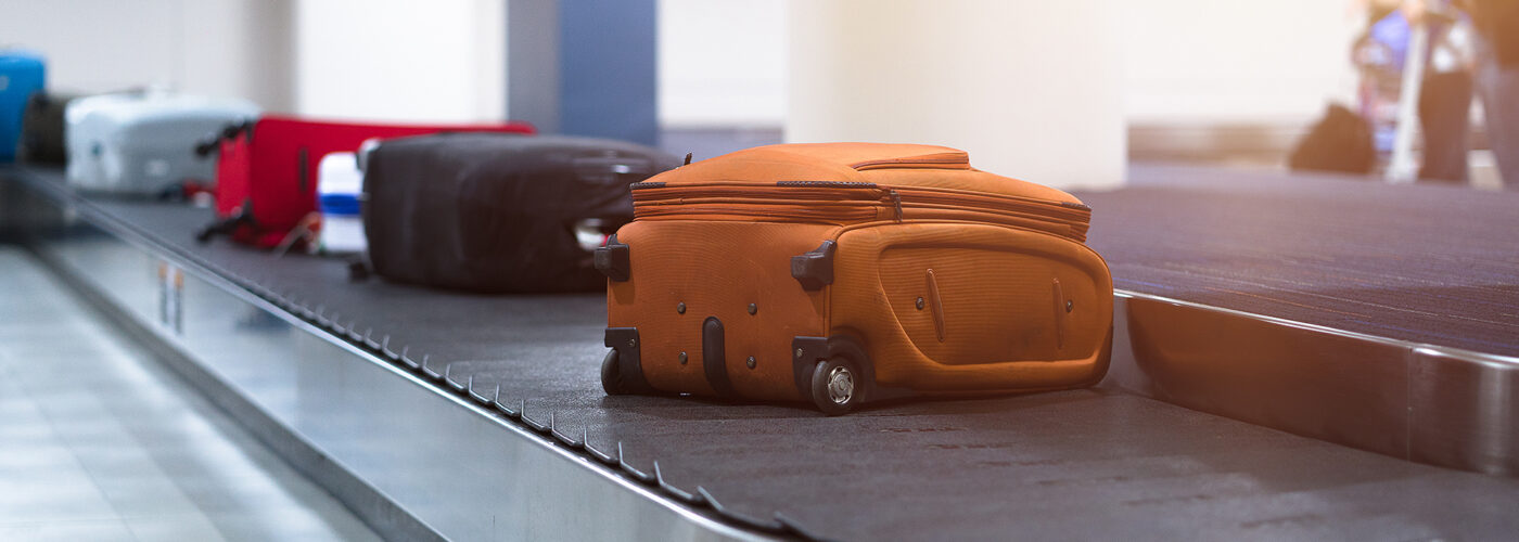 suitcases on luggage carousel.
