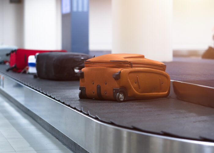 suitcases on luggage carousel.