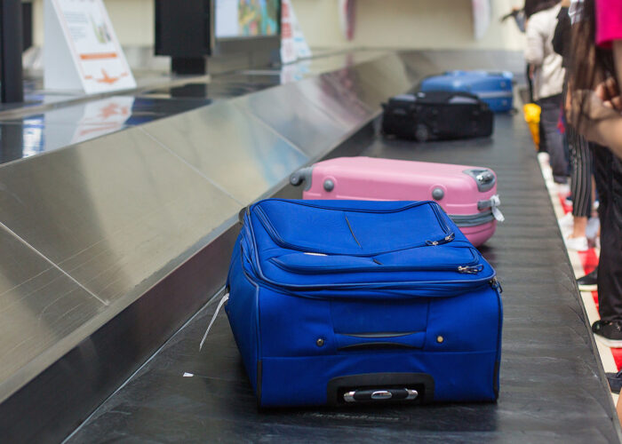 suitcases on baggage carousel.