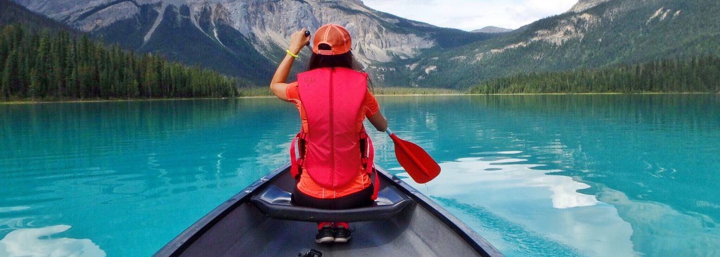 woman canoeing emerald lake canada