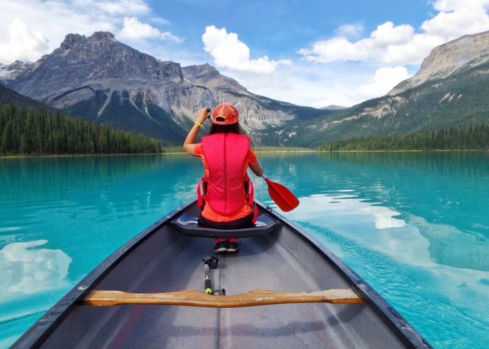 woman canoeing emerald lake canada