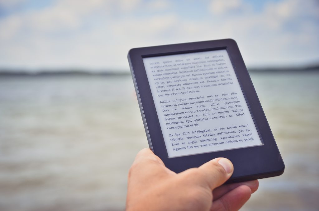 kindle e reader with ocean background