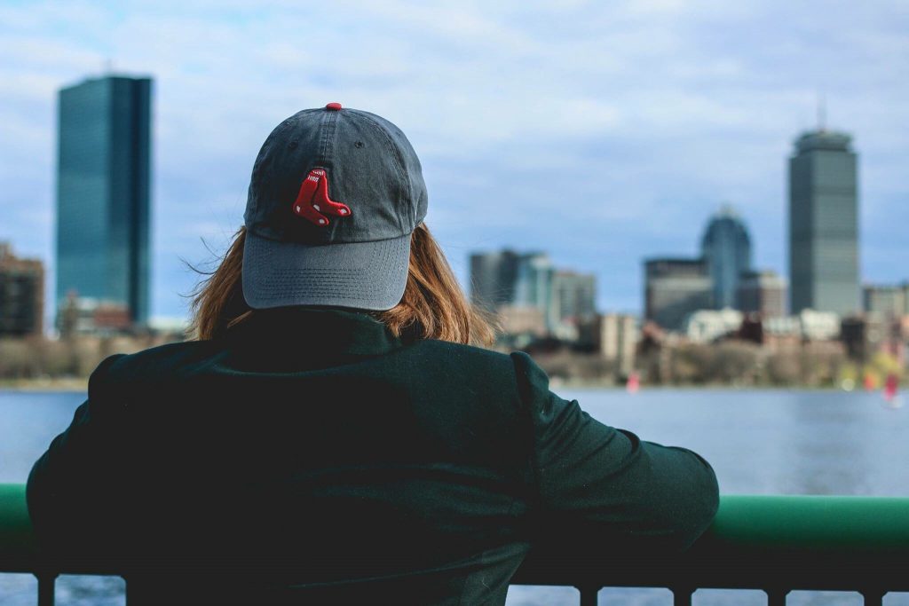 woman wearing red sox cap boston