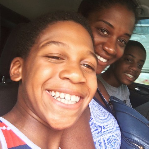 mom and sons in back seat