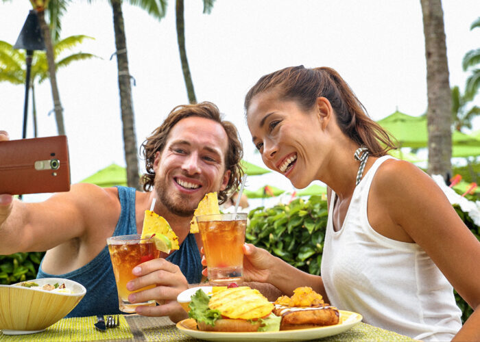 couple toasting cheers with alcoholic hawaiian drinks, Mai Tai, Hawaii