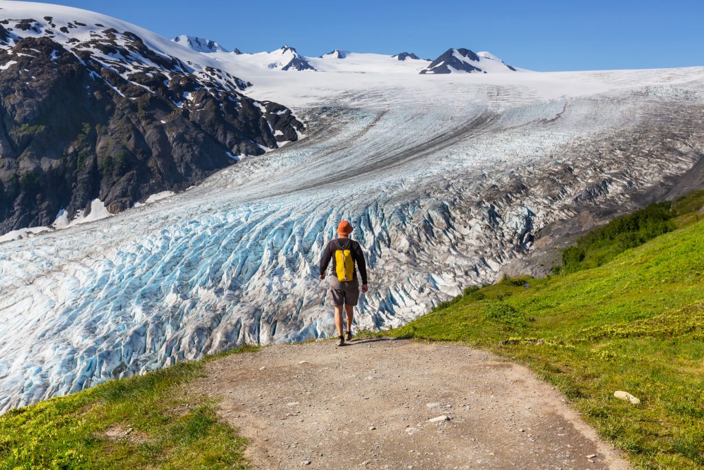 Kenai fjords national park - male walking along glacier