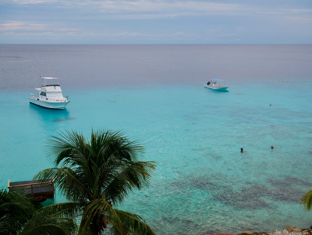 boats in blue water view of ocean curacao