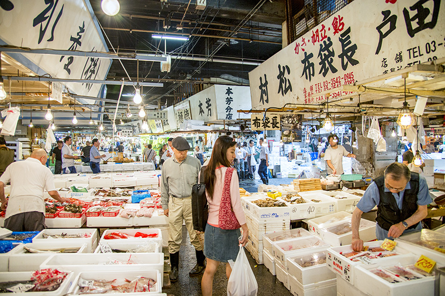 Merchants sale seafood in Tsukiji fish market on July 27, 2013 in Tsukiji, Japan. Tsukiji fish market is one of biggest fish market in the world 