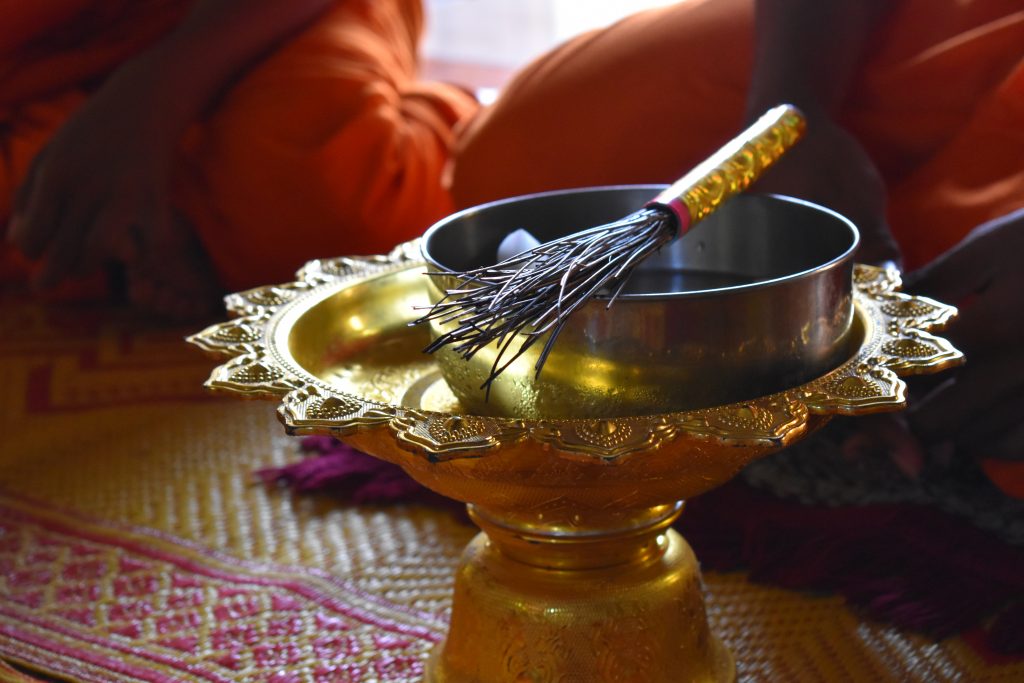side image of a water blessing bowl in small temple cambodia
