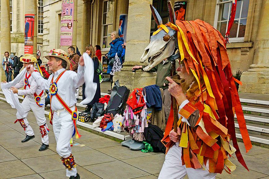 The Gloucestershire Morris Men dancing outside the Subscription Rooms, with Mari Lwyd