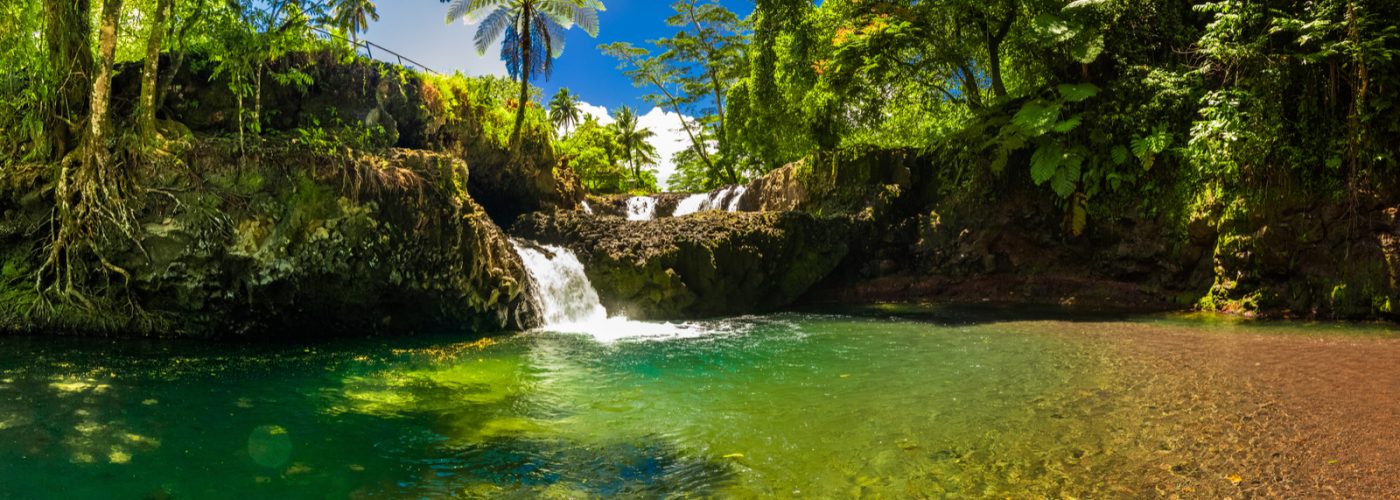 Vibrant Togitogiga falls with swimming hole on Upolu, Samoa Islands