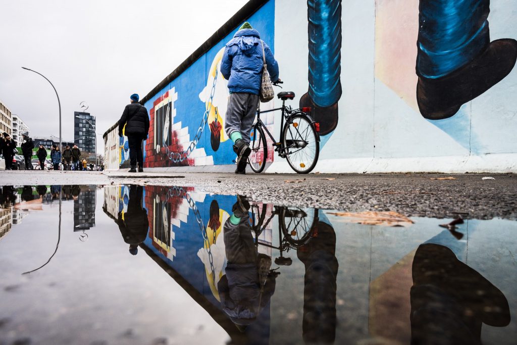 reflection of berlin wall art installation