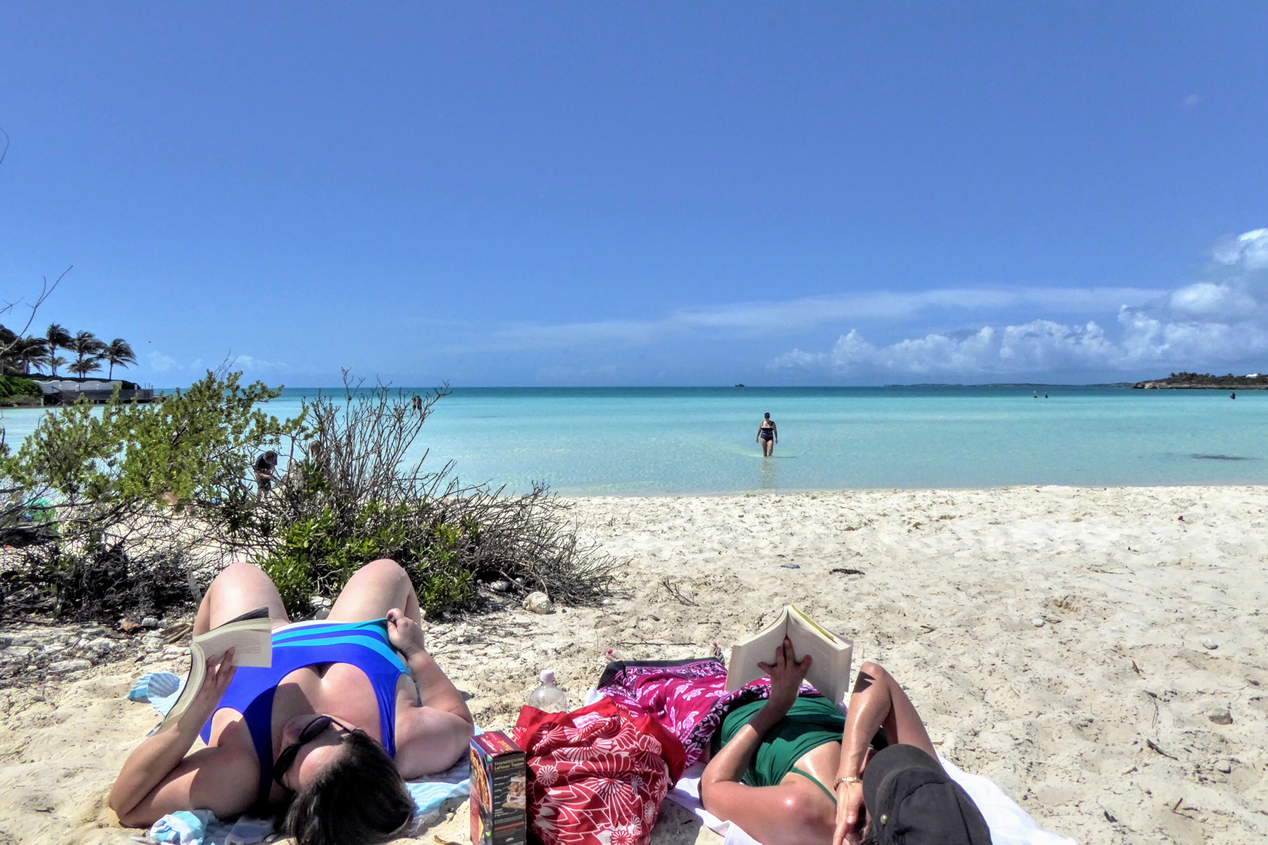 people lying on beach in turks and caicos