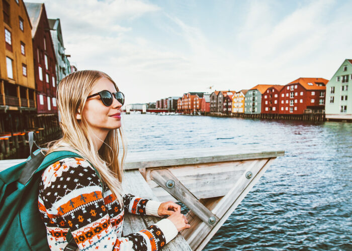 blonde woman traveling in Trondheim city Norway