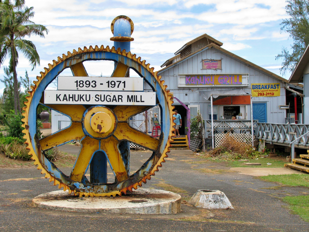 giant machine cog on display at the decommissioned Kahuku sugar mill plantation on the island of Oahu Hawaii