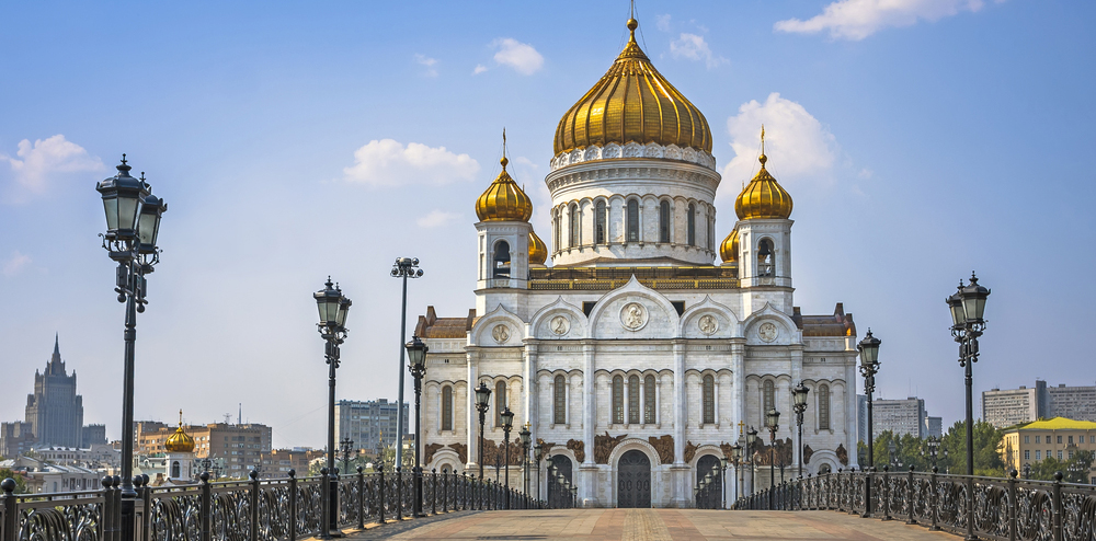 white church with gold-colored dome in moscow, russia