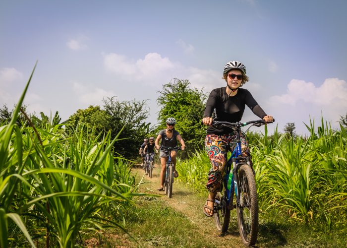 woman riding bike in vietnam on trip