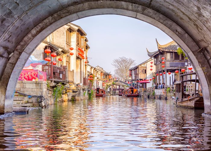 view from beneath canal bridge in Suzhou, China.