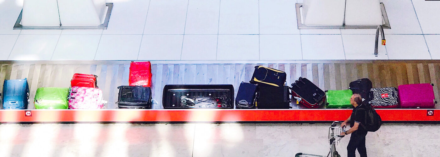 baggage claim belt luggage man claiming