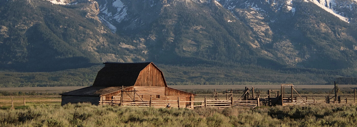 Mormon Row barn and Grand Teton National Park mountains in Jackson Hole, Wyoming.
