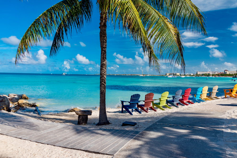 colorful chairs on beach in aruba