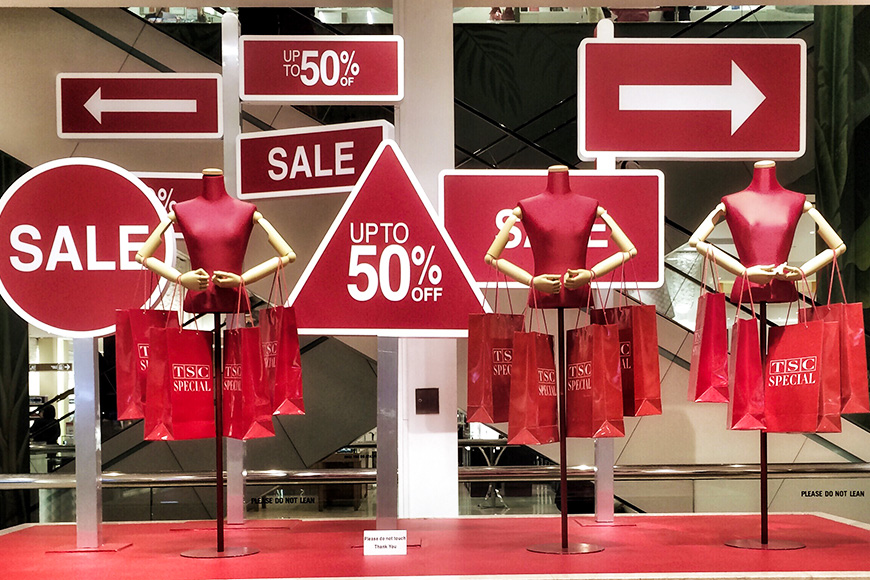 sale signs shopping window mannequins