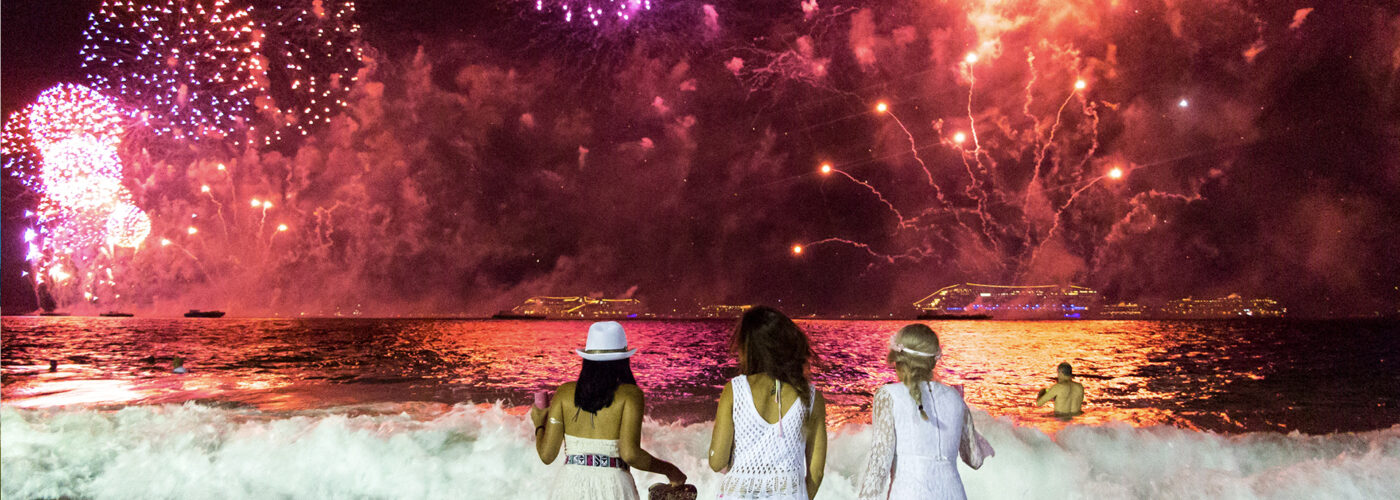 Young ladies looking the New Year's Eve fireworks in Rio de Janeiro, Brazil