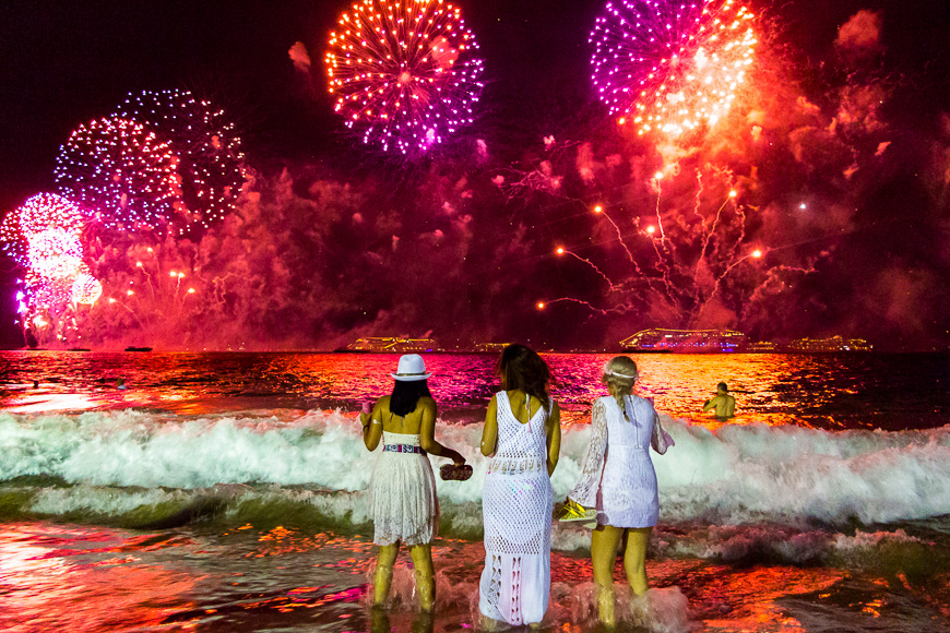 Young ladies looking the New Year's Eve fireworks in Rio de Janeiro, Brazil