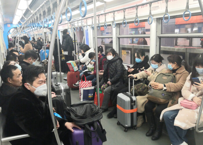 people wearing masks on china metro train.
