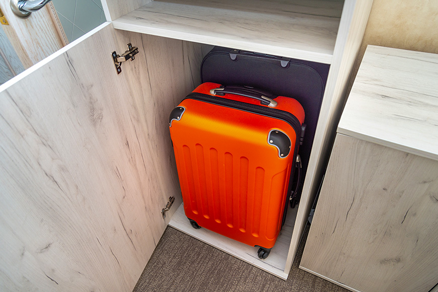 suitcase storage in closet