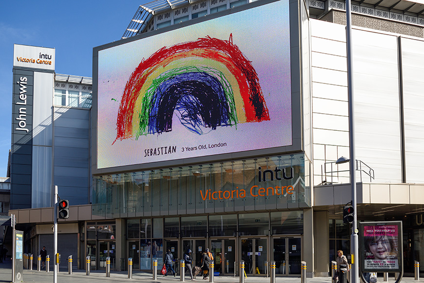 Nottingham city Rainbow messages of hope from children displayed on advertising board outside Intu shopping mall Nottingham.