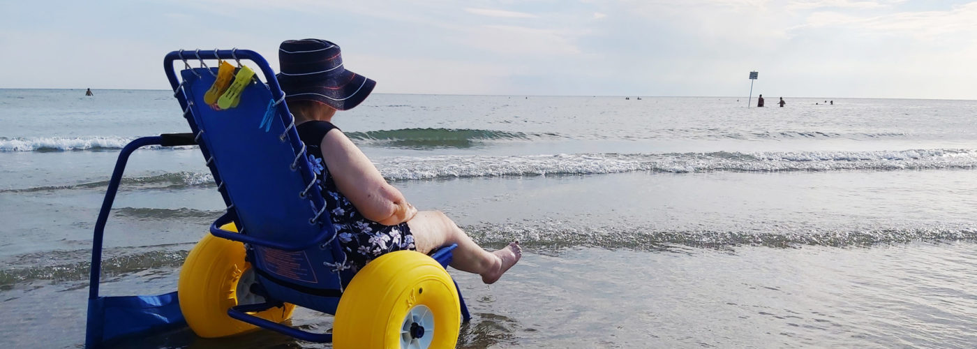 Woman in beach wheelchair