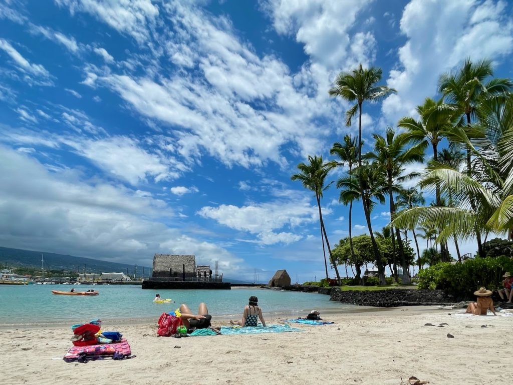 People resting on the beach in Hawaii