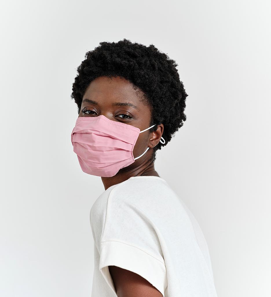 Woman wearing a pink caraa face mask