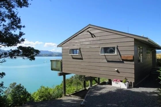 Wooden vacation rental home by the sea in Coromandel Peninsula, New Zealand