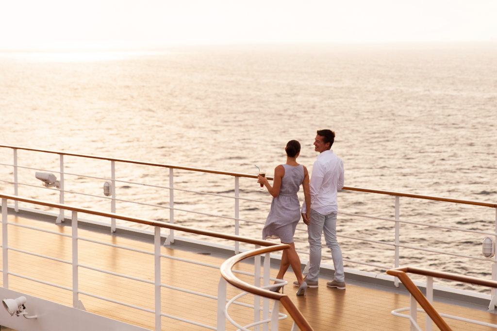 Couple strolling on cruise ship deck