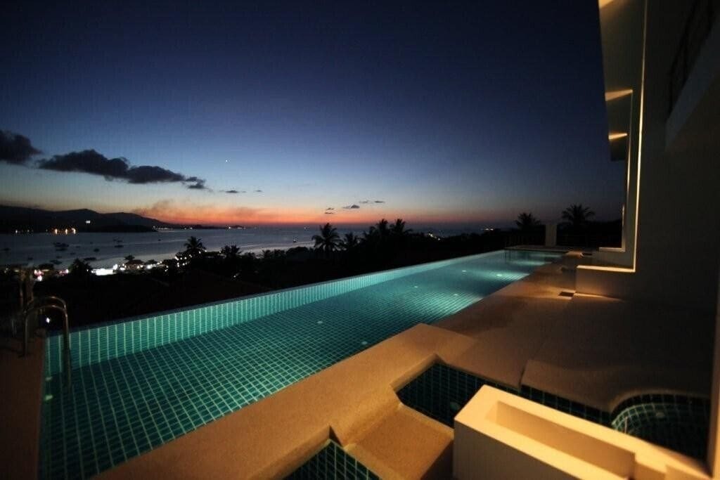 A swimming pool at night in Koh Samui, Thailand