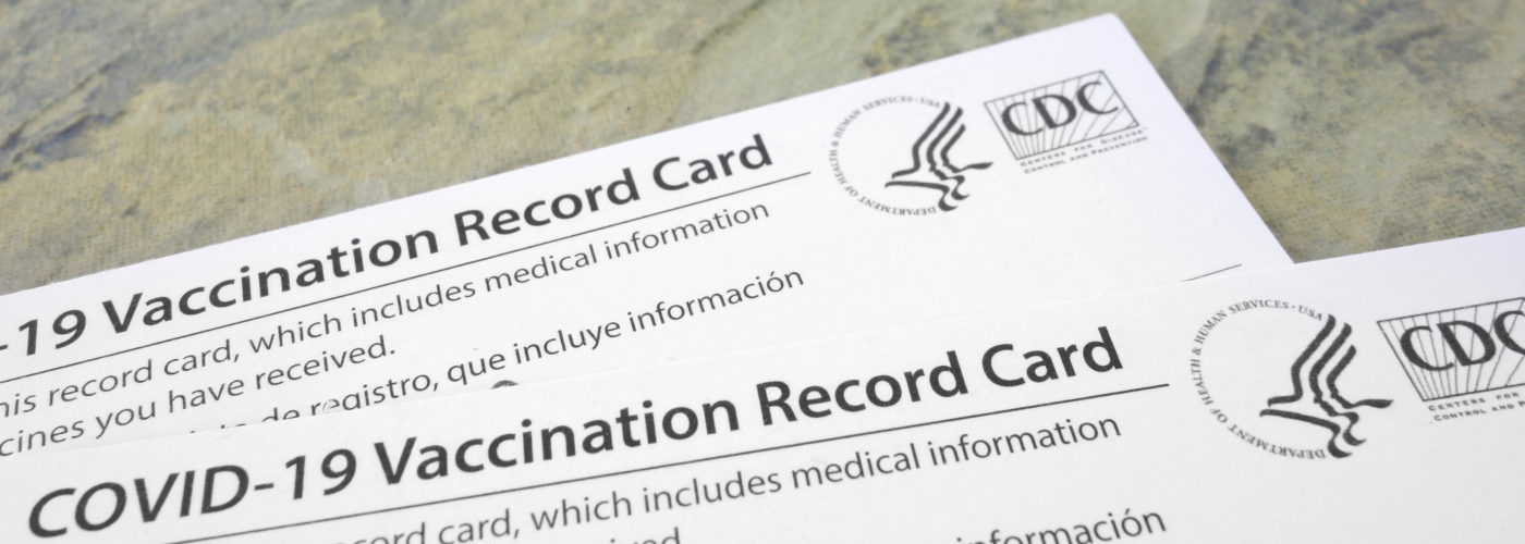 Two COVID-19 vaccination cards
