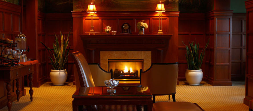 Sitting room with lit fireplace at the Spa at Hotel Hershey