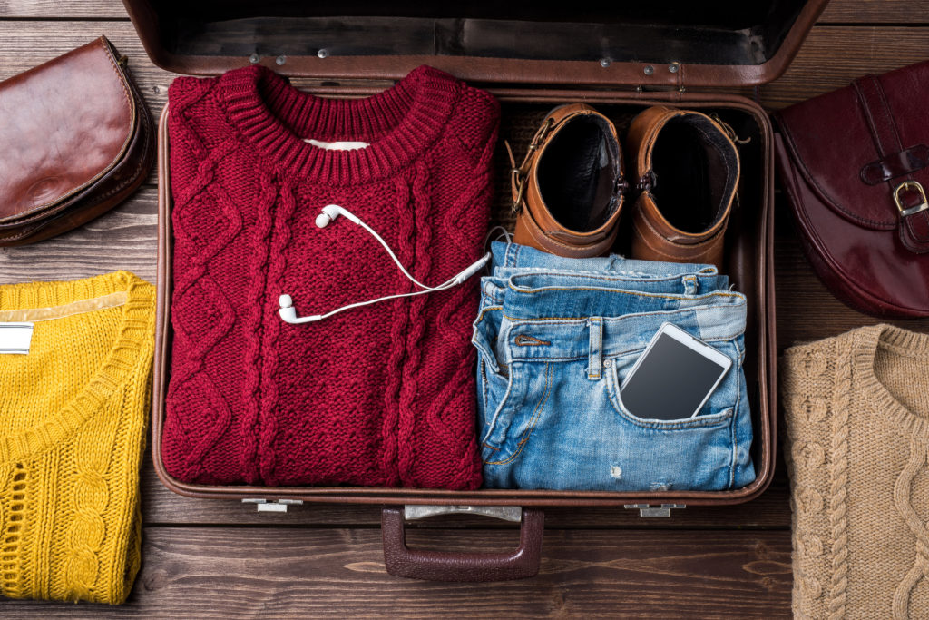 Suitcase full of winter clothes