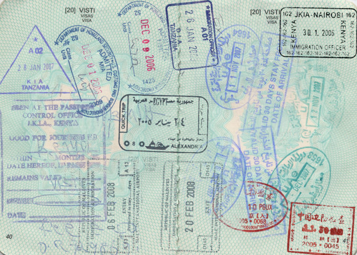 Passport pages full of stamps