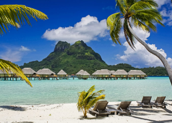 Overwater bungalows as seen from a beach in Bora Bora