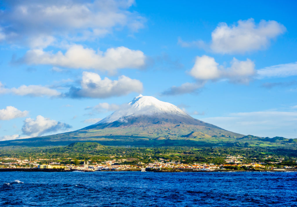 Mount Pico, Ilha do Pico, Azores, Portugal with town and ocean in foreground
